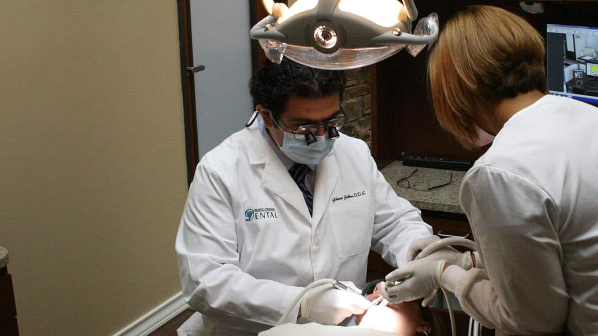 Dr. Jabbour treating a patient in the operatory