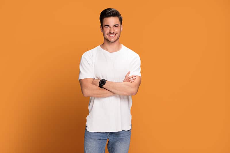 Person smiling confidently after dental treatment